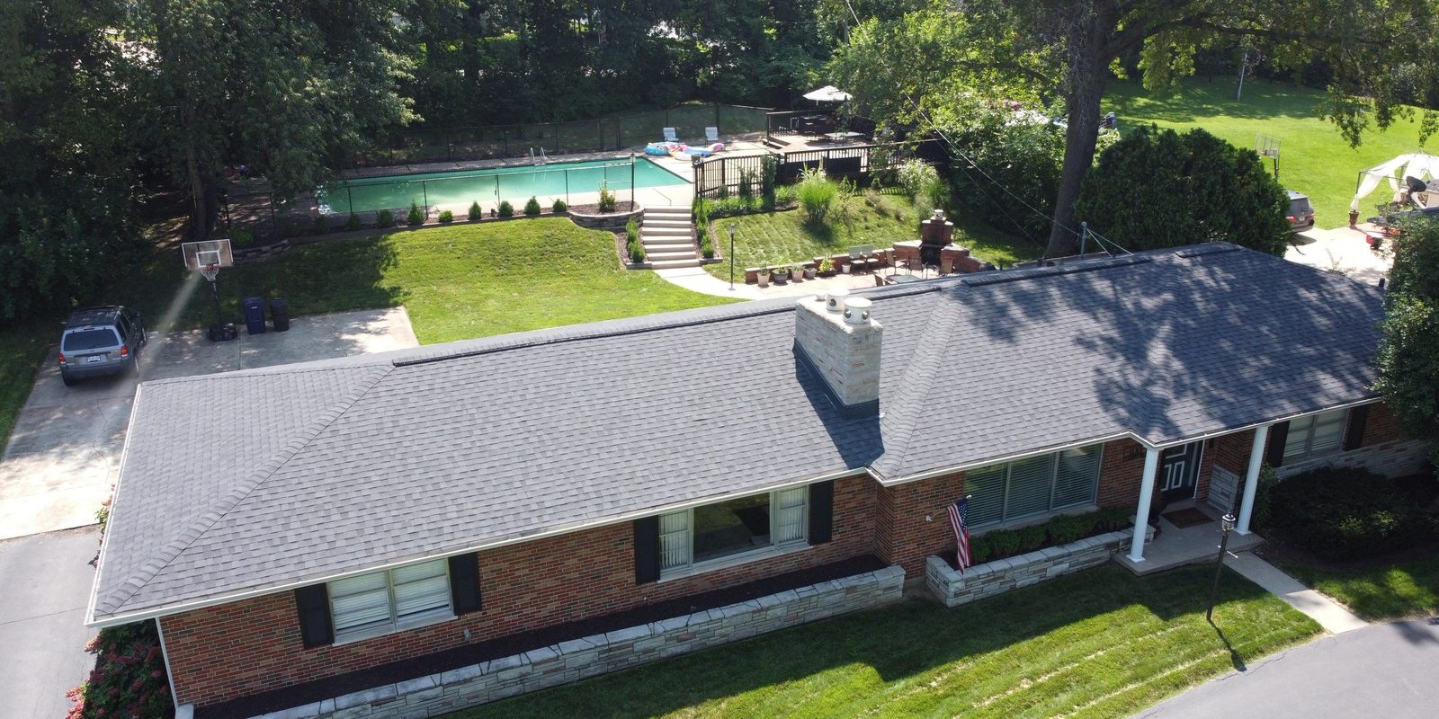 Aerial view of a St. Louis home with newly installed seamless gutters by Reliant Exteriors