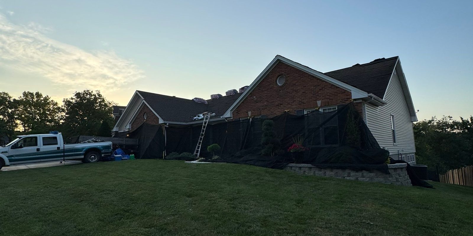 Reliant Exteriors crew responding to a storm-damaged home in St. Louis